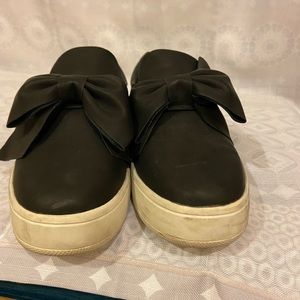 Black slip on sneakers with bow